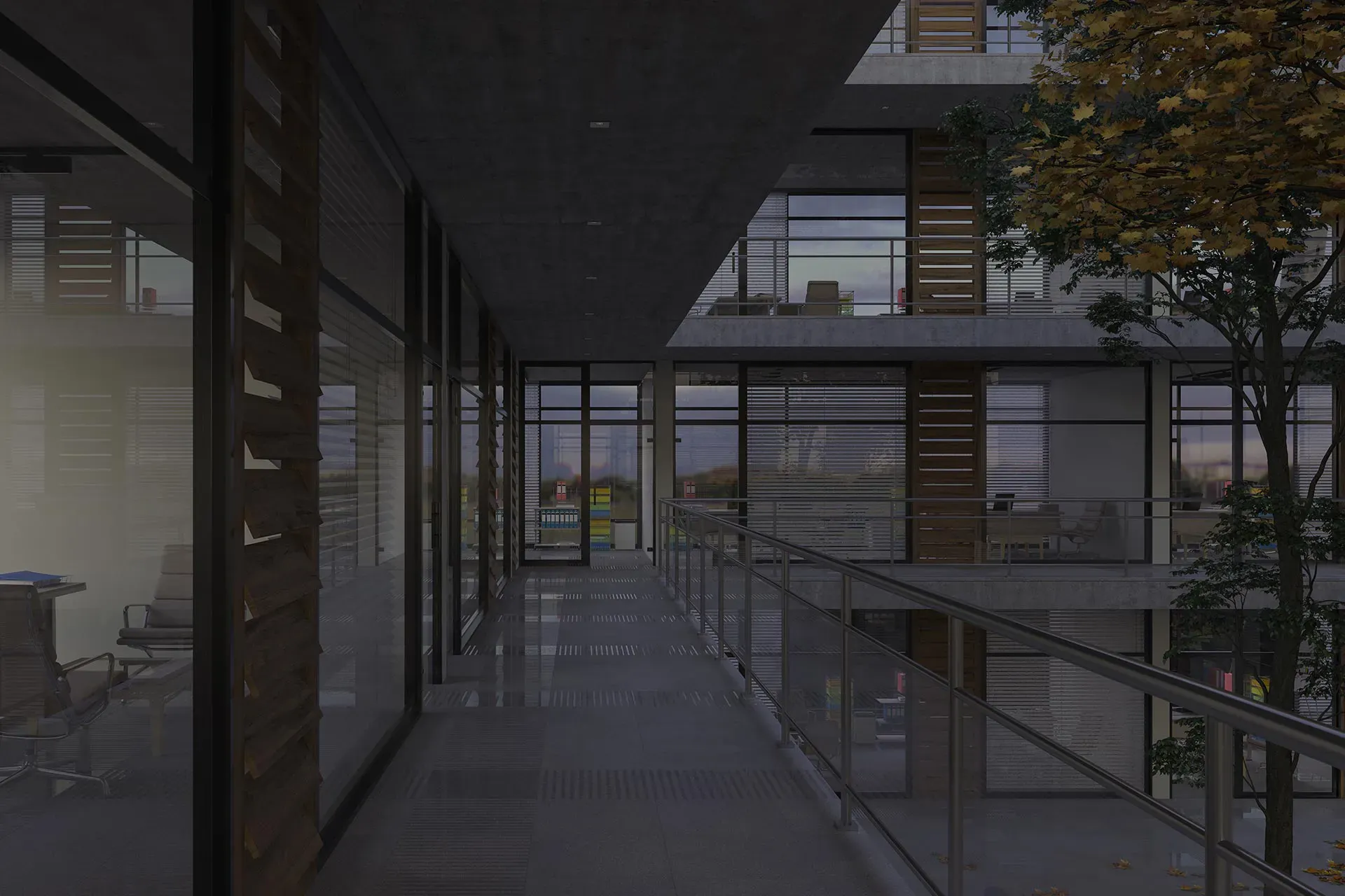 Andar de uma empresa com um corrimão de vidro e uma arvore no meio