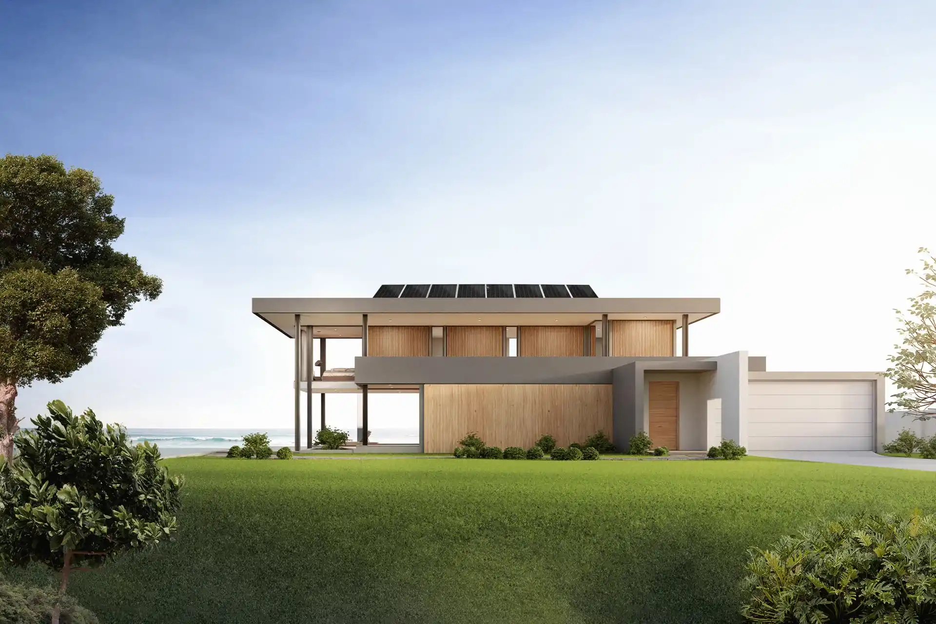 Moradia moderna com dois andares em frente ao mar e com jardim à volta 